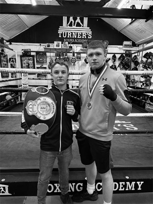 Boxers with belt at Turner’s Boxing Academy